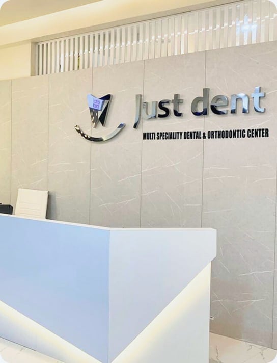 Just Dent signage above the reception counter